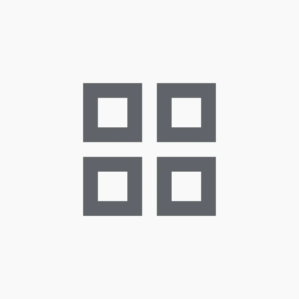 A simple grid icon with four squares arranged in a 2x2 pattern on a plain background.