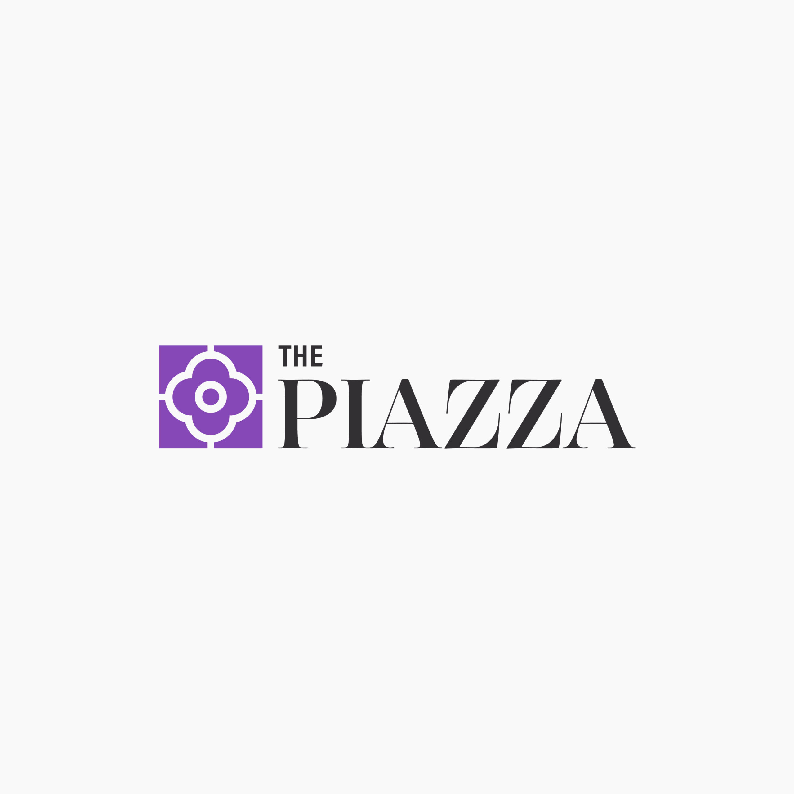 Logo displaying the text "The Piazza" in black with a purple emblem to the left featuring a circular design within a square. The background is plain white.